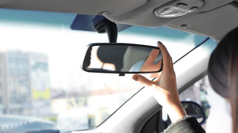 Adjust rear view mirror