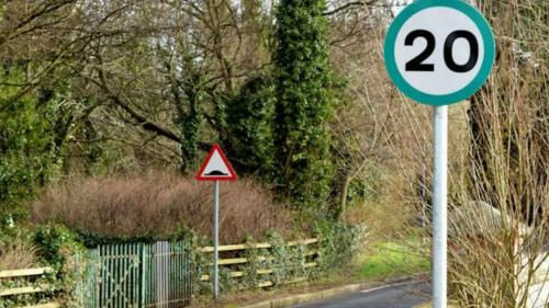 Speed limit sign in green circle 2